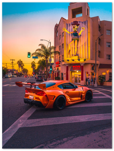 Tableau photo d'art en plexiglas montrant une voiture de course orange à Los Angeles